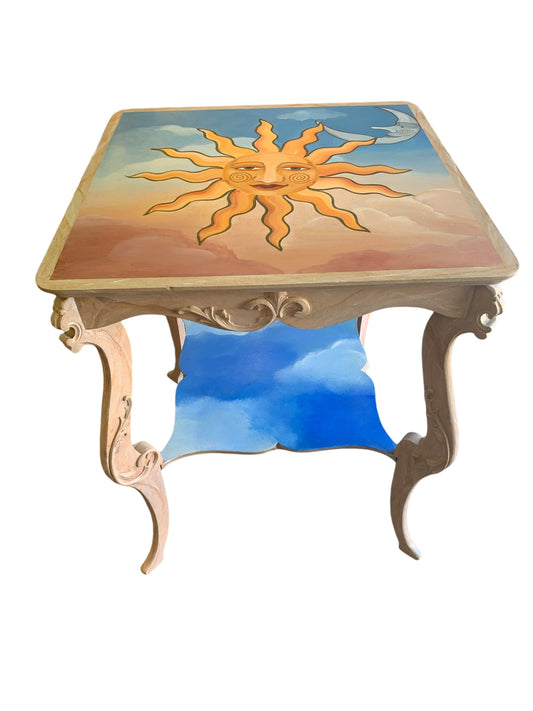 Handpainted sun-motif carved table, 24x24x30"