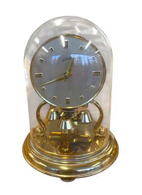 Brass Schatz anniversary clock in glass dome, 6" h