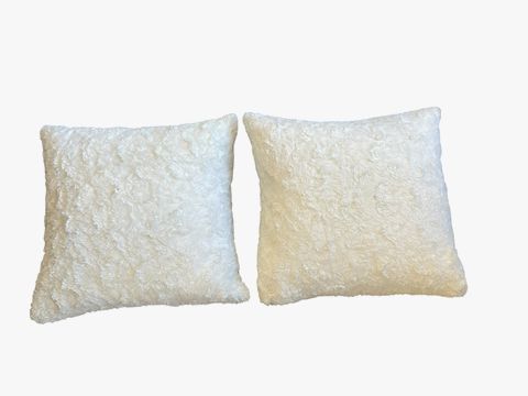 Pair of Ugg faux fur pillows, 24x24