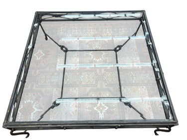 Square beveled glass-top coffee table on patinated bronze base w/ knot details,