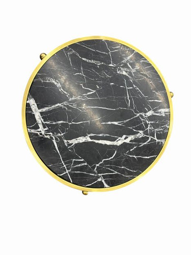 Round goldtone tripod table w/ black marble top, 25" h, 19" diam.
