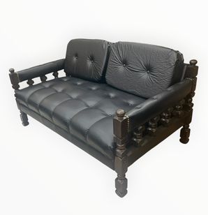 Black faux leather Spanish Revival loveseat, 31.5" h, 55" w, 22" d
