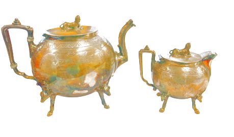 Egyptian Revival silverplate teapot (7" h x 5.25" w) & creamer, 5" h x 5.5" w x