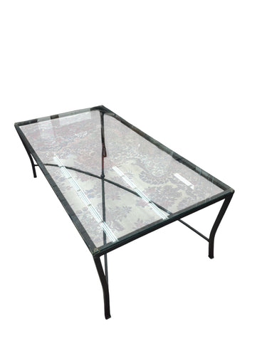 Beveled glass-top coffee table on black cast-iron "X" base, 16" h, 48" w, 23.75"
