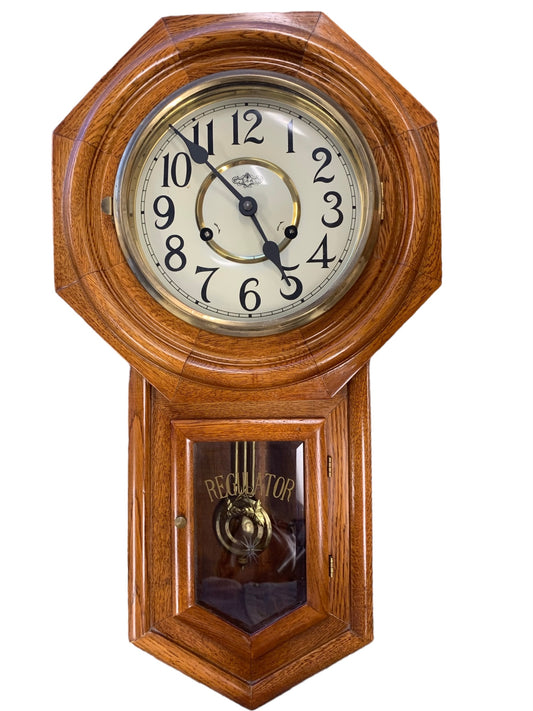 Oak schoolhouse pendulum clock w/ key, 12.5x5x23"