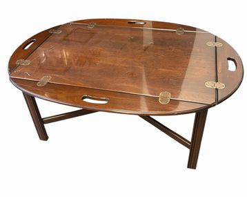 Oval mahogany butler's coffee table, 17.25" h, 42" w x 30.25" d (leaves down)