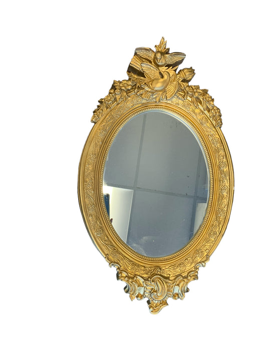 Oval mirror in ornate gold frame, 15.75x27"