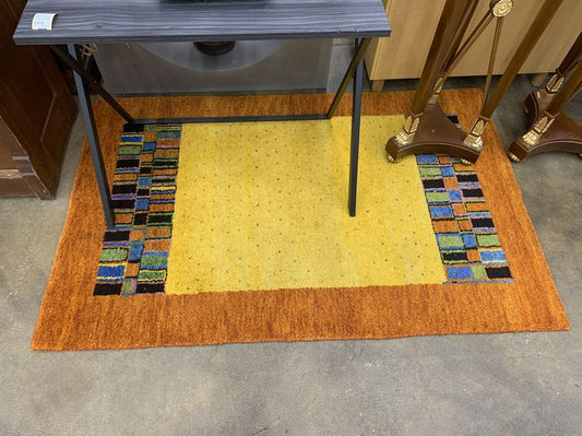 Modern yellow/orange rug w/ multicolored sections, 64x41"