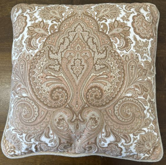 Cream colored paisley pillow
